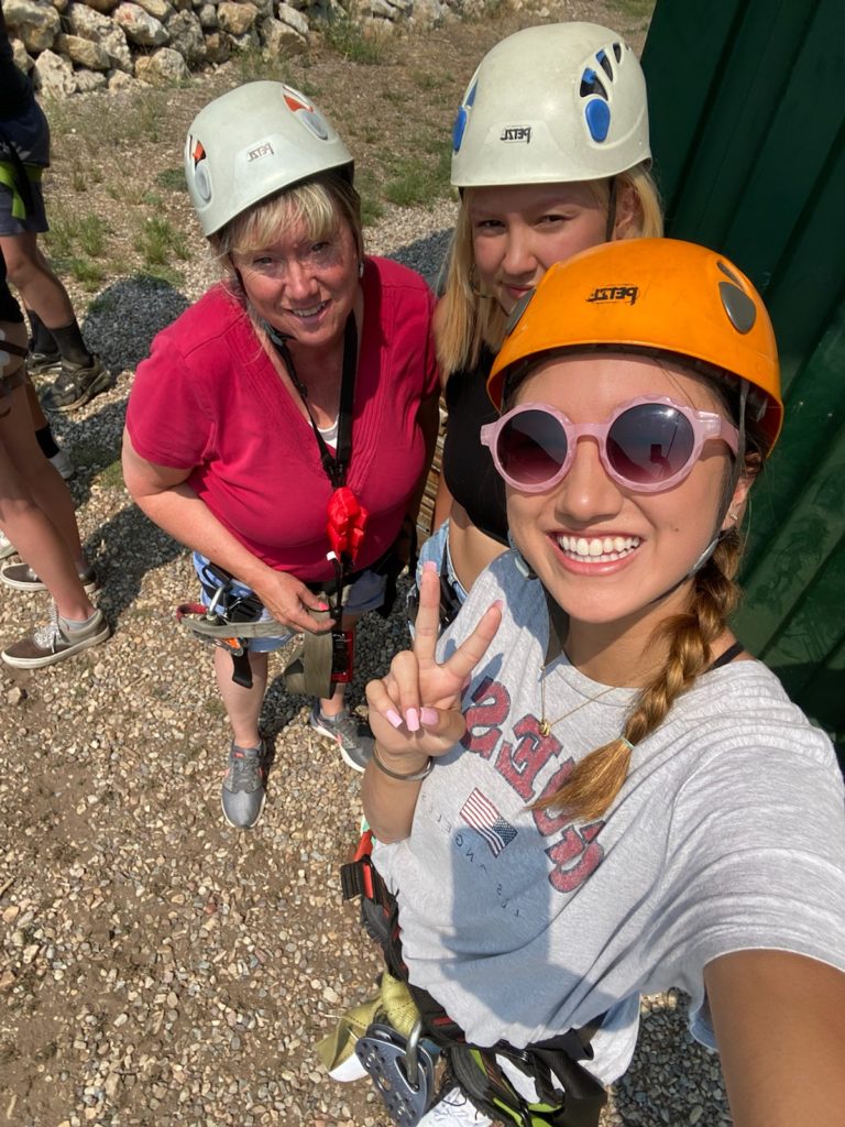My daughters and I waiting to try ziplining for the first time.