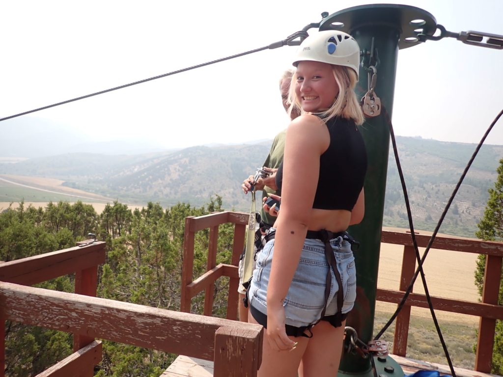 My daughter getting ready to leave the platform for the second zipline.