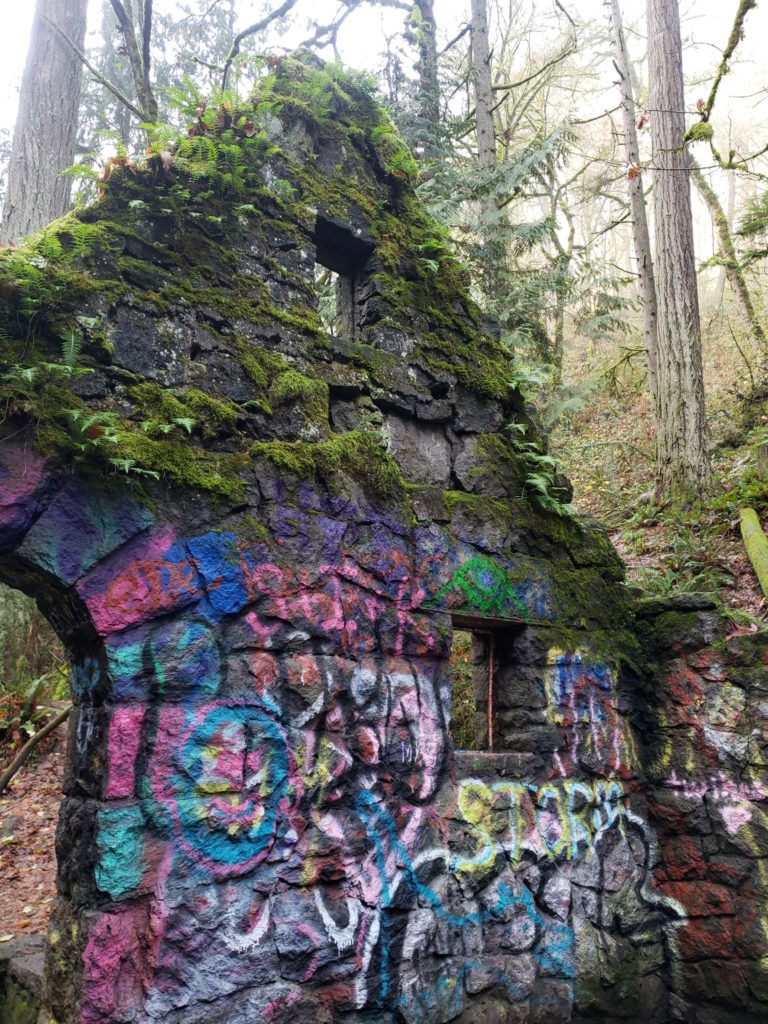 Close up of the colorful moss and graffiti covering the Witch's Castle